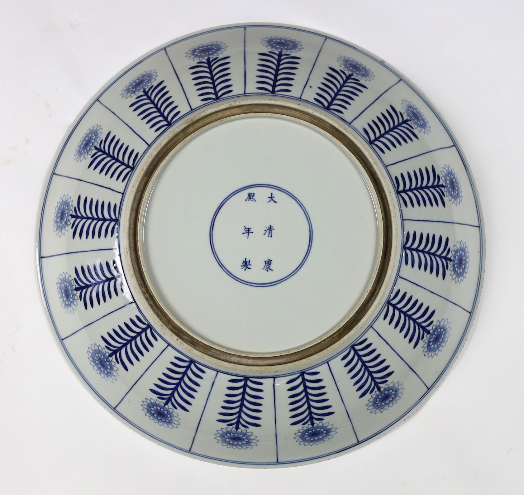 A pair of massive Chinese blue and white Aster pattern dishes, Kangxi mark but Republic period, 54.5cm diameter, one with a small section broken and restuck